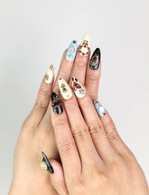 Model wearing Gothic Blossoms handmade Singapore press on nails with metallic roses and rhinestones, elegant and trendy by naillover